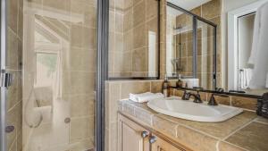 a bathroom with a sink and a shower at Marillac by AvantStay Gorgeous Ski Cabin w Balcony Patio in Olympic Valley +15 photos