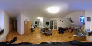 a living room with a couch and a table at Tanie Noclegi Krysia Falsztyn in Falsztyn