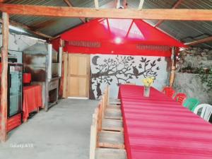 a red table with a red carpet in a room at Casa Corazao in Urubamba +95 photos