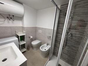 a bathroom with a toilet and a sink and a shower at Matterhorn Studio Cervinia in Breuil-Cervinia +44 photos