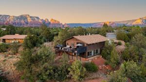 an aerial view of a house with mountains in the background at Roca Roja by AvantStay Mountain Views in the Heart of Sedona in Sedona