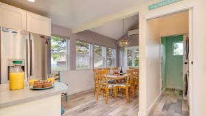 a kitchen and dining room with a table and chairs at Beach Pines Bungalow by AvantStay Classic Cottage Steps to the Beach w Private Yard in Arch Cape