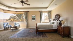a bedroom with a bed and a large window at Sangiovese By AvantStay Spectacular Estate w Pool Hot Tub Putting Green in Temecula +44 photos