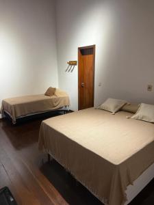 Postel nebo postele na pokoji v ubytování Pousada Casa do Cais + 7 fotografií