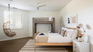 a bedroom with a bed and a fireplace at Villa Verbena by AvantStay Expansive Estate w B-ball Court PoolSpa Entertainers Yard in Bermuda Dunes +39 photos