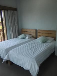 Llit o llits en una habitació de Ju'Blu Hotel