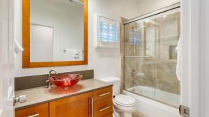 a bathroom with a red bowl sink and a shower at Pool Hot Tub Yard Games Chic Midcentury Design Painted Sand by AvantStay in Bermuda Dunes +23 photos