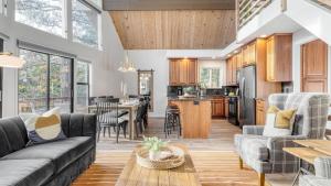 a living room with a couch and a table at North Bay by AvantStay Chic Retreat w Peloton in Blue Jay