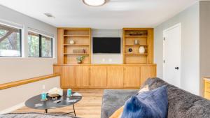 a living room with a couch and a tv at North Bay by AvantStay Chic Retreat w Peloton in Blue Jay