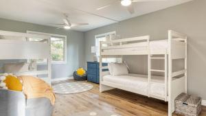 a bedroom with two bunk beds and a couch at North Bay by AvantStay Chic Retreat w Peloton in Blue Jay