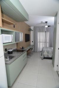 a kitchen with a sink and a counter top at Green One - Em Frente à Estação Luz com vaga rotativa in Sao Paulo