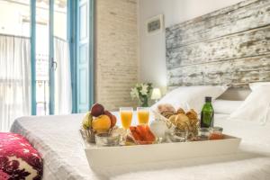 Un ou plusieurs lits dans un hébergement de l'établissement Hotel Boutique Casa de Colón