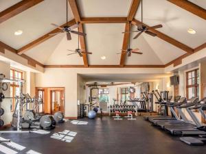 a gym with a lot of treadmills and ellipticals at Fairmont Sonoma Mission Inn & Spa in Sonoma