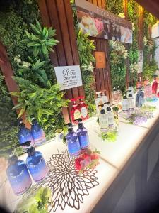 a table with a bunch of bottles of liquid at リンドス in Okayama