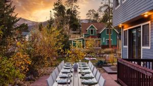 a table set up for a meal on a patio at Paddington by AvantStay Cozy Chic Ski Lodge Mins from Mountain in Breckenridge