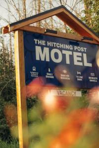 a sign for the hitchiking post mortet motel at The Hitching Post Motel in Pemberton