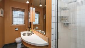 a bathroom with a sink and a shower at Arch Cape Escape by AvantStay Sensational Clift Top Home w Pacific Ocean Views in Arch Cape