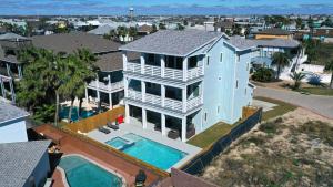 an aerial view of a house with a swimming pool at Private PoolHot Tub Near the Beach Gulf Glimpse Marlin Cove by AvantStay in Port Aransas