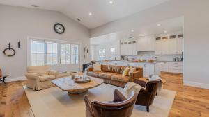 a living room with a couch and a table at Cooperage by AvantStay Vineyard Views Soccer in Templeton