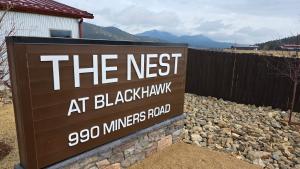 a sign that reads the nest at blackhawkeco mines road at The Nest at Black Hawk in Black Hawk
