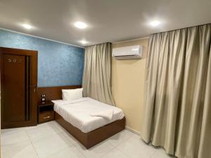 Ένα ή περισσότερα κρεβάτια σε δωμάτιο στο Jewel pyramids & Grand museum view