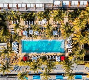 an overhead view of a hotel with a swimming pool and palm trees at Resort chic on the water! in Key West