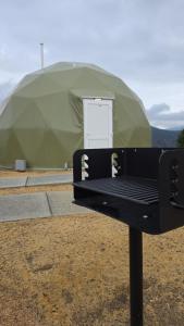 a black bench in front of a green tent at The Nest at Black Hawk in Black Hawk +87 photos