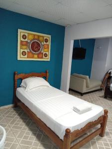 Ένα ή περισσότερα κρεβάτια σε δωμάτιο στο Hotel Guest