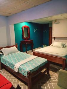 Ένα ή περισσότερα κρεβάτια σε δωμάτιο στο Hotel Guest