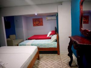 Ένα ή περισσότερα κρεβάτια σε δωμάτιο στο Hotel Guest