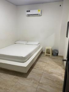 Postel nebo postele na pokoji v ubytování Hotel Nellamar