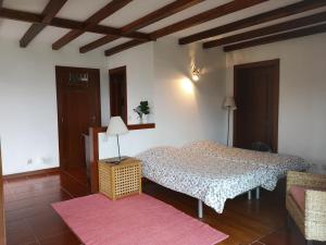 Giường trong phòng chung tại T0 Eira Frente