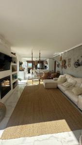 a living room with a couch and a fireplace at Praia da Barra Sweet Home in Gafanha da Nazaré +84 photos