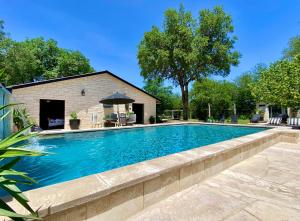 a swimming pool with a retaining wall around it at Agua Bonita in Concan
