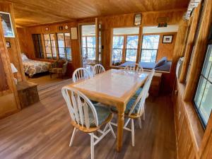 a dining room with a table and chairs at On the Rocks! in Concan