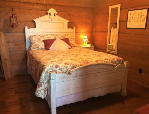 a bedroom with a large bed in a room at La Casita in Concan
