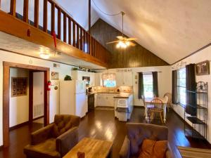 a kitchen and living room with a couch and a table at Rusty Rio in Concan