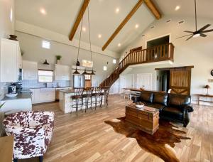 a large living room with a couch and a table at Pretty Penny in Concan