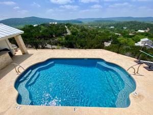 a large swimming pool on top of a house at Pretty Penny in Concan