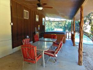 a dining room with a table and chairs at Shady Oak in Concan
