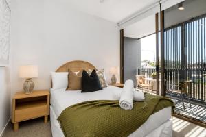 Кровать или кровати в номере Aurelia Byron