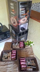 two trays of food on a table next to a box at HABITACIONES ALUC, se reserva solo con seña in Chuy