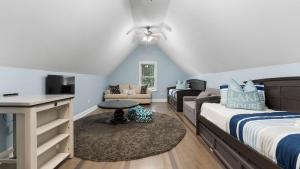 a bedroom with a bed and a living room at Laid Back Lake Life by AvantStay Waterfront View in Mooresville