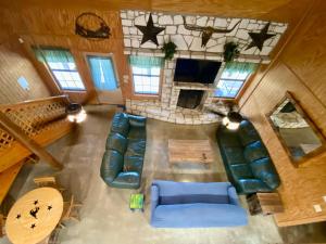 an overhead view of a living room with a blue couch at HILLSIDE in Concan