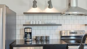 a kitchen with a coffeemaker on a counter at Carter 202 by AvantStay 1BR Balcony in Nashville