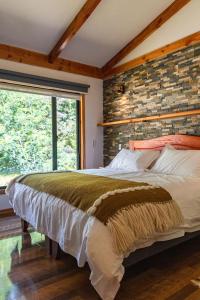 Postel nebo postele na pokoji v ubytování Lican Lodge