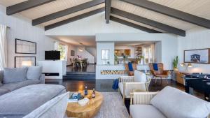 a living room with a couch and a table at Lakeview by AvantStay Private Waterfront Cabin on Lake Tahoe w Hot Tub Views in Tahoe Vista