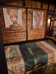 Postel nebo postele na pokoji v ubytování le petit chalet cevenol