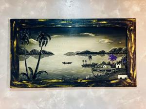 a picture of a painting of a beach with palm trees at Hospedagem Marechal 03 in São Roque
