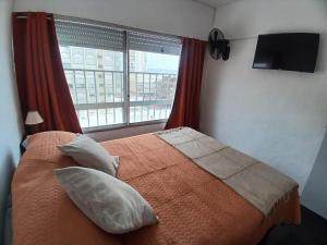 Ένα ή περισσότερα κρεβάτια σε δωμάτιο στο Edificio MICHELANGELO PENINSULA PUNTA DEL ESTE